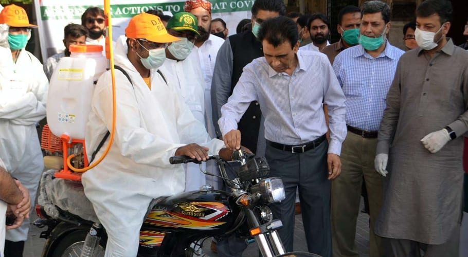 Khalid Maqbool Siddiqui distributes motorcycle keys for spray campaign