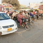 Traffic control in Karachi with the help of ropes and wires
