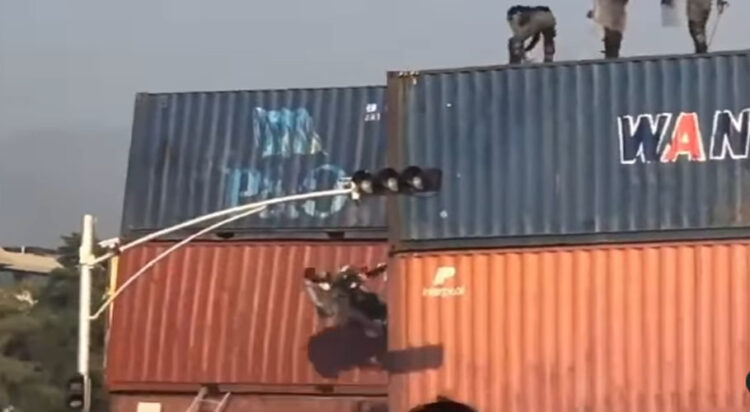 Protester praying on container thrown down by security forces: Watch video