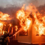 Los Angeles wildfires rage as strong winds put millions on alert