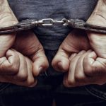 ایک شخص کو گرفتار حالت میں دکھایا گیا ہے