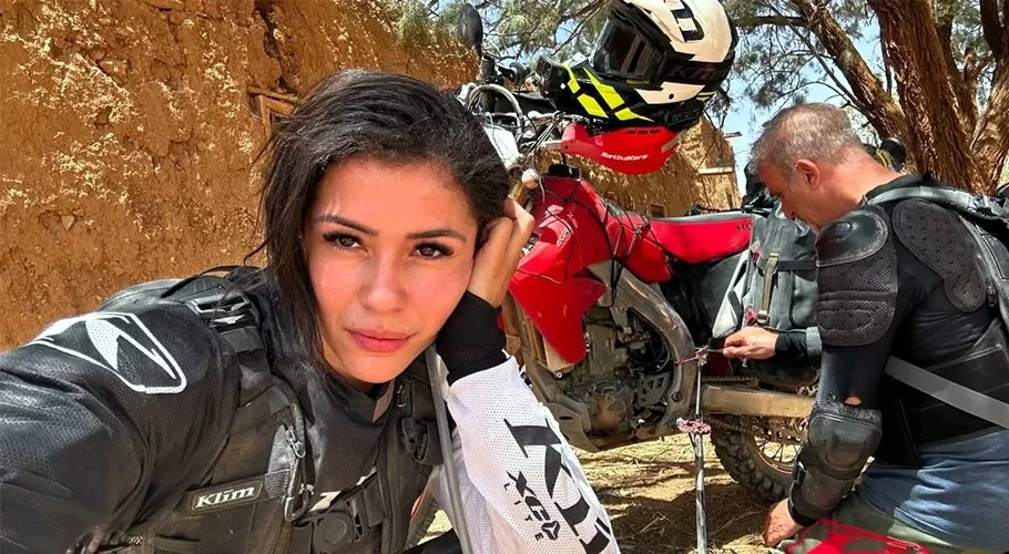 Woman gang-raped by seven men in India continues her motorcycle world tour with husband